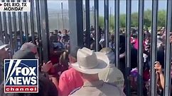 Fox News captures 'shocking' footage of migrants forcing way past border