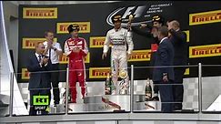 F1 Lead - Lewis Hamilton splashes champagne on Putin
