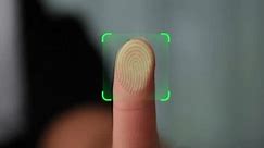 Woman Activates ID in Fingerprint Scanning on Tech Device Panel Close-up. Concept of Digital Biometric Identification Sensor Screen Security, guard concept for mobile application smartphone unlock.