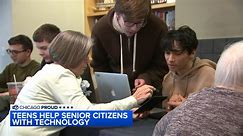 High school students from Hoffman Estates help Schaumburg senior citizens learn to use technology