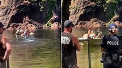 Tourists scrambled out of water after croc attack in NT