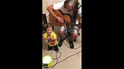 Toddler goes viral for singing a duet with grandfather