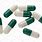 Green and White Capsule Pill