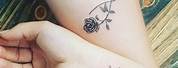 Infinity Symbol with Flower Wrist Tattoo