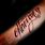 Never Give Up Forearm Tattoo