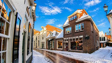 Snow-covered streets through medieval Amersfoort in winter (4K)