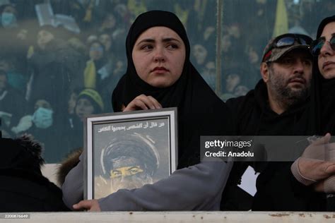 Mourners gather at Camille Chamoun Sports City Stadium for the... News ...