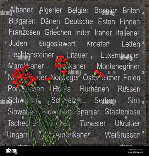 13 April 2026, Thuringia, Nordhausen: Flowers lie on a memorial stone in front of the ...