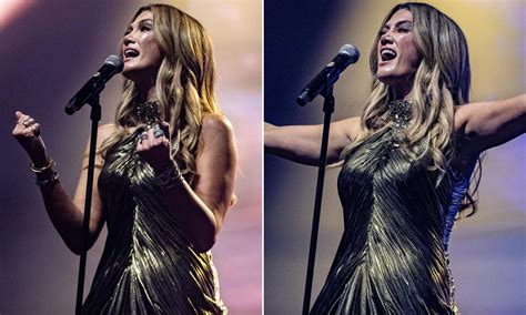 Delta Goodrem dazzles in gold as she takes the stage at Eurovision in ...