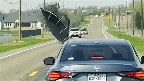 Texas winds send trampoline flying down road