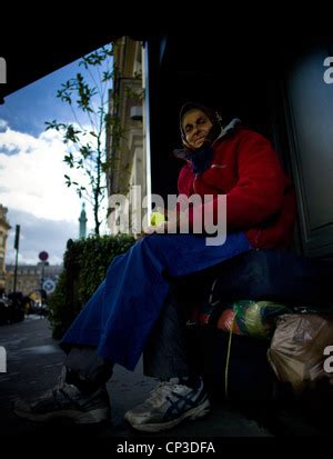 Old lady tramp on bench in Rome, Italy Stock Photo - Alamy
