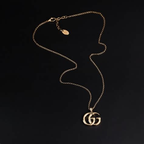 GG Marmont pendant necklace in gold-toned brass | GUCCI® PT