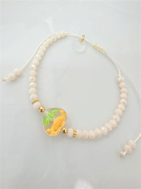 PULSERA - ORO LAMINADO FLOR MURANO NATURAL | Liberá Joyas