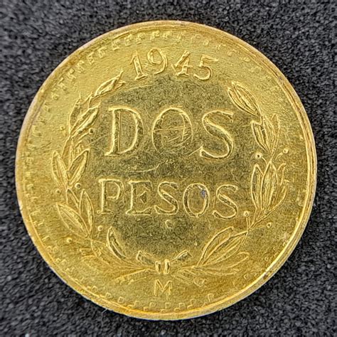 At Auction: A 1945 900 Purity Gold Dos Pesos Mexican Coin.
