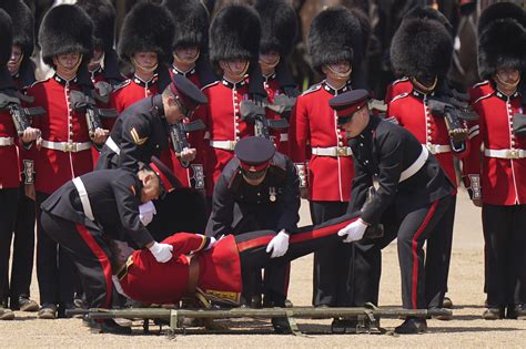 Several British royal guards faint due to heat during ceremony with ...