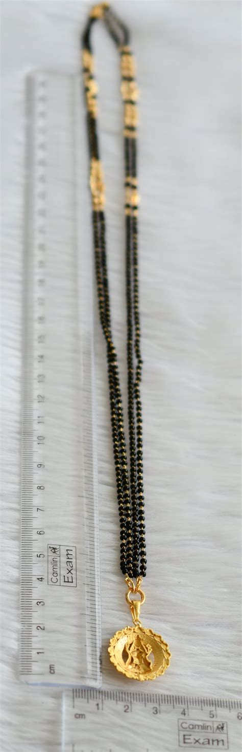 Gold tone 24 inches karimani mangalsutra chain with lakshmi round pend ...