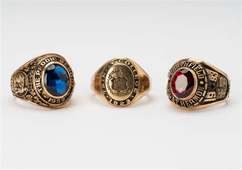 Lot - THREE 10 KARAT GOLD CLASS RINGS