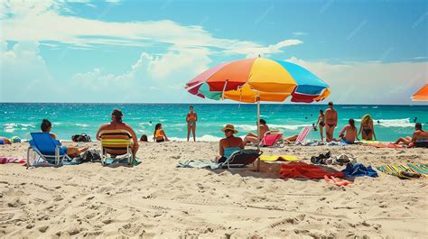Premium Photo | People relaxing on beach under colorful umbrella