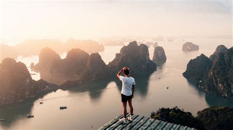 Download wallpaper 3840x2160 man, rocks, water, height, view, overview ...