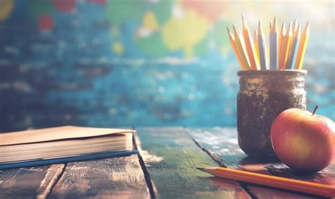 School backpack and stationery on desk in classroom | Premium AI ...