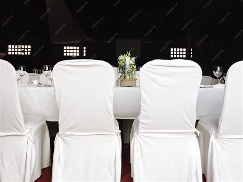 Premium Photo | Chairs and table arranged at wedding reception