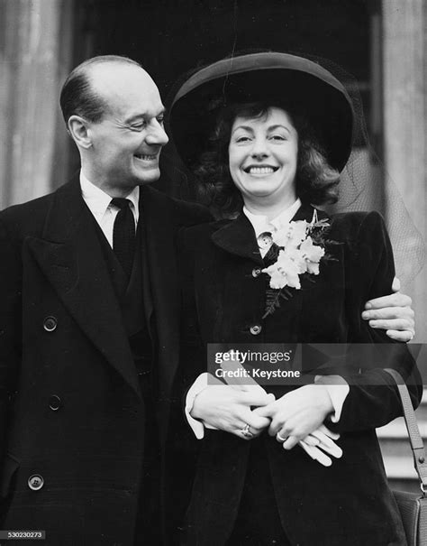 Portrait of actor Ronald Ward with his arm round his new wife Betty ...