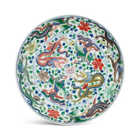 A large wucai 'dragon and phoenix' dish, Mark and period of Kangxi ...