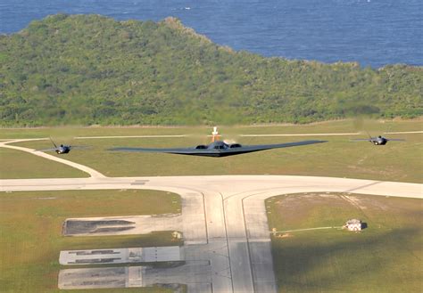 One USAF B-2 Spirit stealth bomber and two USAF F-22A Raptor stealth ...
