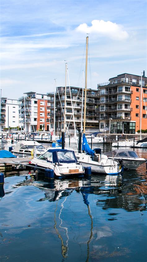 Download wallpaper 1350x2400 boats, pier, city, buildings, water iphone ...