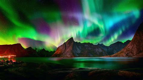 Download The Aurora Borealis ornates the night sky with mesmerizing ...