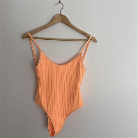 low back orange one piece swimsuit only worn once - Depop