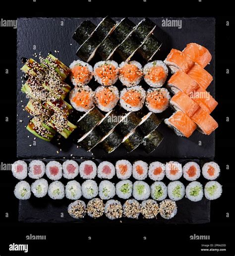 Sushi rolls of Japanese cuisine on a stone board. Set of sushi rolls ...