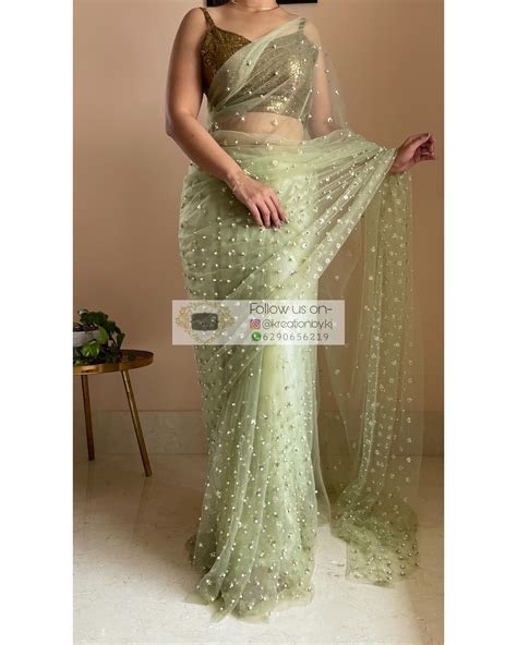 Green Net Saree embellished with exquisite sequins ,pearls- kreationbykj