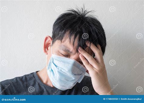 The Face of Sick Asian Chinese Man Wearing Face Mask Feeling Sick Headache and Cough because of ...