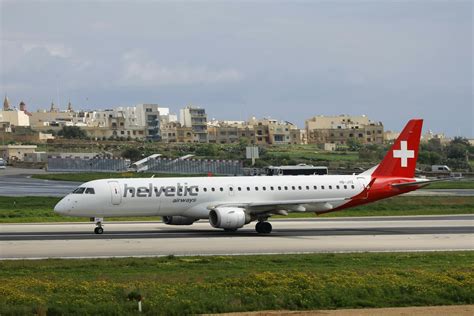 Helvetic Airways Plane on Tarmac at Runway · Free Stock Photo