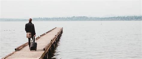 Download wallpaper 2560x1080 pier, man, suitcase, travel, kirkland ...