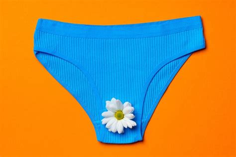 Womens panties with flower buds on paper background | Premium Photo
