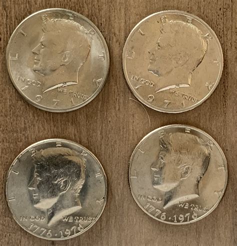 (4) MS 60 Kennedy Half Dollars. (2) 1971 P and (2) 1776-1976 P ...