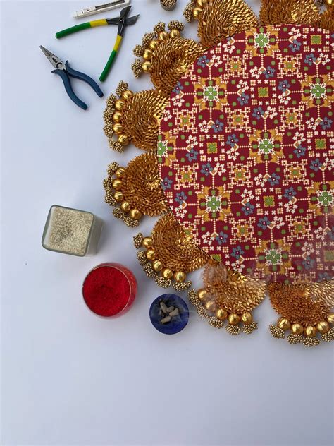 The Maroon Navratna Gota Scallop Rangoli – IBHI