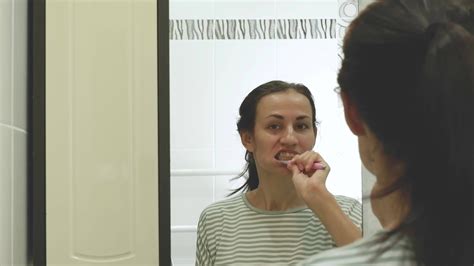 Daily dental care. Portrait of a young pretty brunette Spanish woman ...