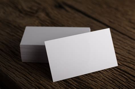 Blank white business card presentation of corporate identity on wood ...