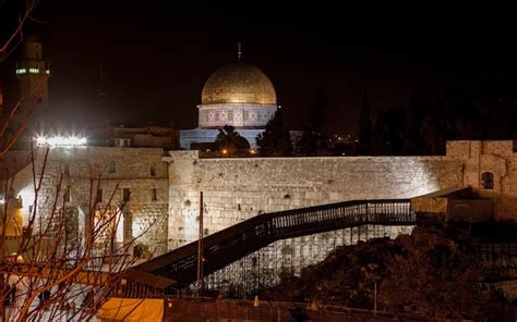 Temple at night illuminated with light from decorations