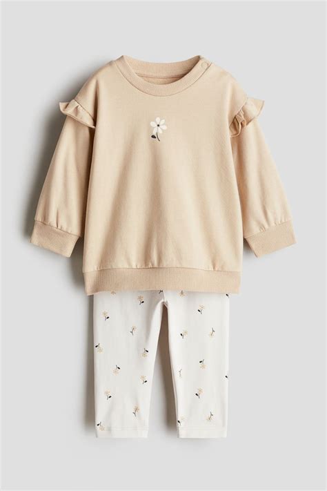 2-piece sweatshirt and leggings set - Light beige/Floral - Kids | H&M IN