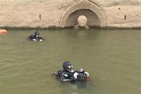 600-Year-Old Sunken Statue Of Buddha Emerges From Water After Levels ...
