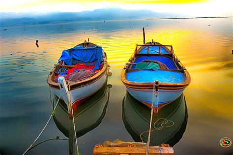 Two Small Boats on Water