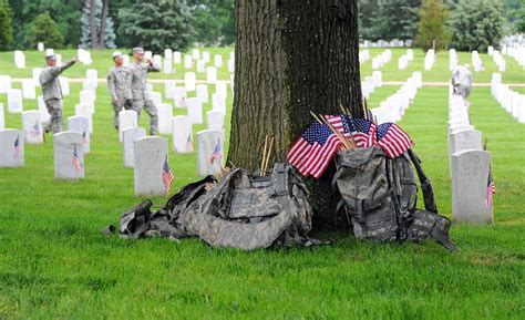 Soldiers participate during Flags In at Arlington Cemetery | Article ...