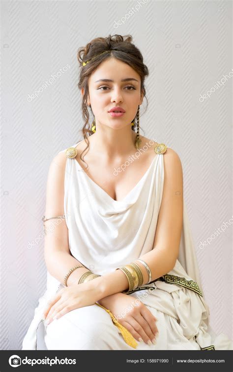 Portrait of a sitting young greek woman in antigue white dress — Stock ...