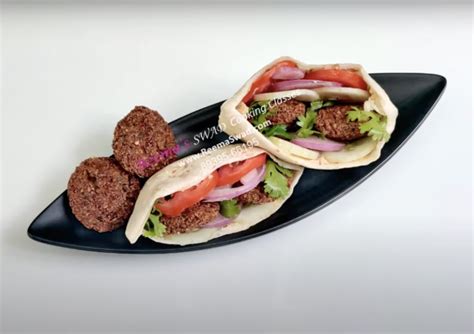 Pita bread stuffed with Falafel and Hummus - Reema Swad Cooking Classes