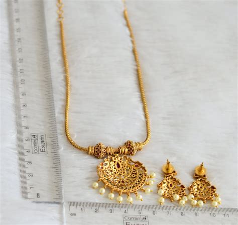 Matte finish ruby-green-white pearl peacock necklace set dj-43771 ...
