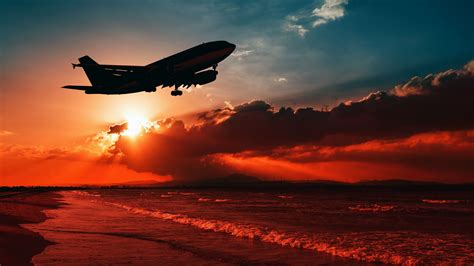 Download wallpaper 3840x2160 airplane, sea, sunset, takeoff, silhouette ...